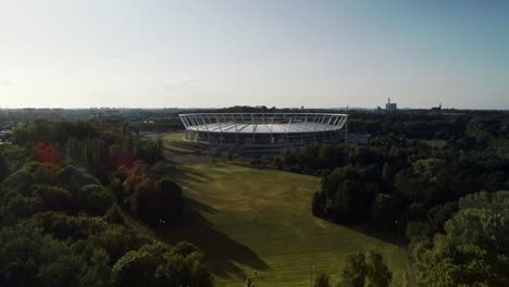 Drone-view-of-urban-stadium-in-the-park,-Katowice,-Poland