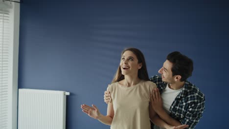 Tracking-video-of-excited-couple-at-new-apartment.