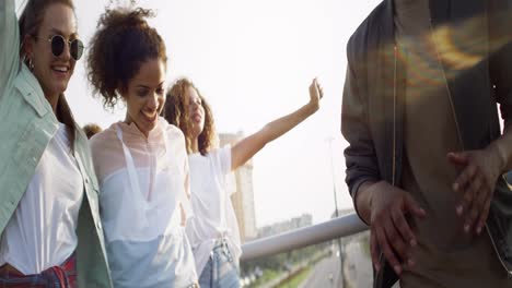 Video-of-happy-group-of-best-friends-running-and-jumping-outdoors