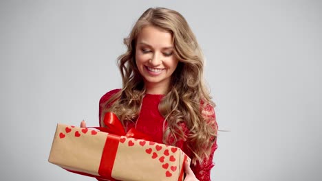 Happy-woman-catching-a-big-gift