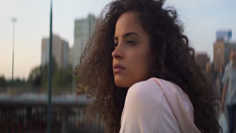 Handheld-video-of-serious-beautiful-Brazilian-woman-outside