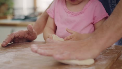 Handheld-view-of-little-girl-making-cookie-with-daddy