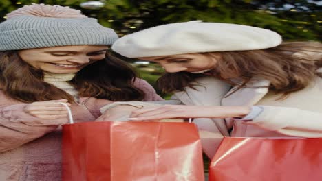 Close-up-video-of-women-boasting-about-already-made-shopping