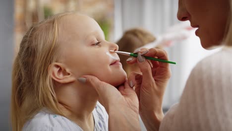 Close-up-video-of-face-painting-for-little-Easter-bunny