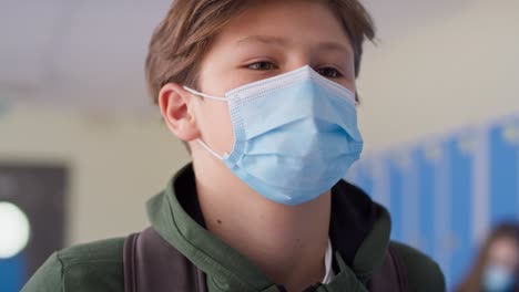 Close-up-video-of-boy-walking-in-protective-face-mask