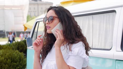 Girl-talking-by-mobile-phone-in-the-city