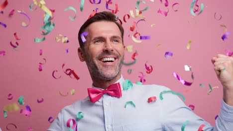 Adult-man-celebrating-with-confetti.