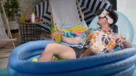 Video-of-man-with-VR-glasses-in-an-inflatable-pool