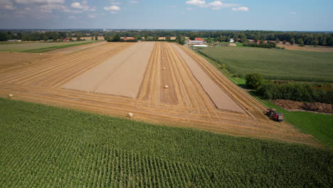 Agricultural-Fields-With-Hay-Bales-In-Summer---aerial-shot