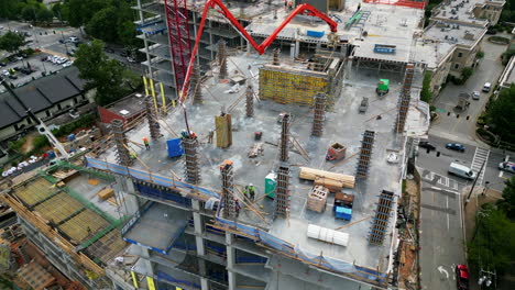 High-angle-view-of-casting-concrete-load-structures-on-multistorey-building-construction-site