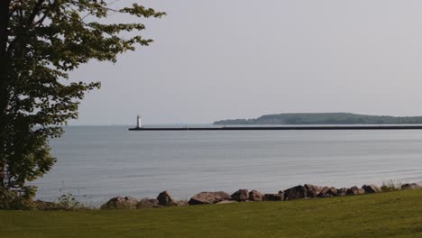 Wide-shot-of-the-small-light-house-at-Sodus-point-New-York-vacation-spot-at-the-tip-of-land-on-the-banks-of-Lake-Ontario