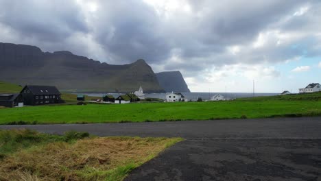 Static-shot-of-a-small-rural-village-in-the-remote-Faroe-Islands-being-covered-by-clouds,-Vidareidi