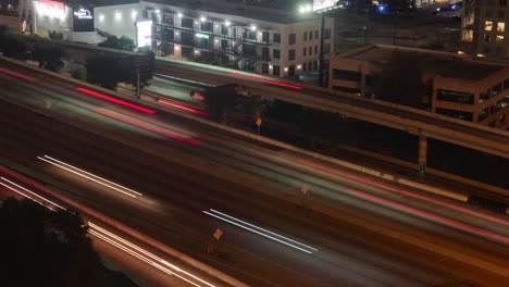 Night-time-lapse-of-busy-traffic,-Houston-Texas