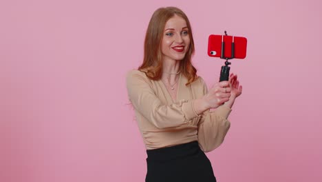 Adult-girl-blogger-taking-selfie-on-mobile-phone,-communicating-video-call-online-with-subscribers