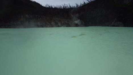 Low-Aerial-Overlook-of-Sulphur-Lake-at-White-Crater-in-Ciwidey,-West-Java,-Indonesia