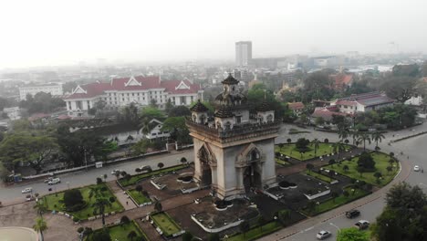Aerial-view-of-Patuxai,-War-Arch-Monument-in-Vientiane-Laos-with-sunrise