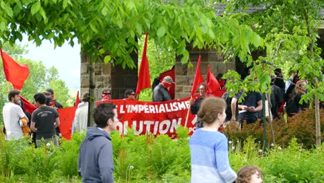 Protesters-holding-a-large-soviet-union-banner-promoting-their-agenda