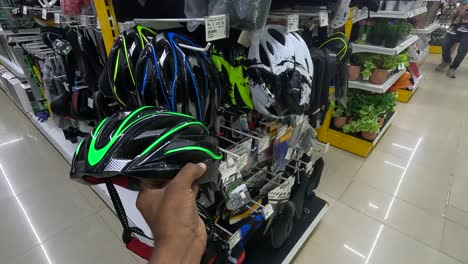 POV-shot,-customer-shopping-for-stylish-cycling-helmets-at-shopping-mall