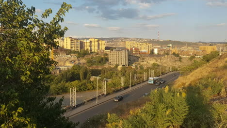 Traffic-and-Residential-Buildings-in-Residential-Suburbs-of-Yerevan,-Armenia-on-Golden-Hour-Sunlight,-Wide-View