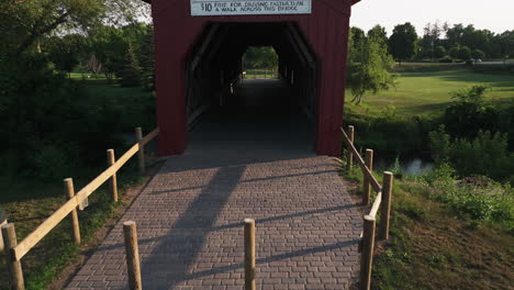 Wooden-Covered-Bridge-With-Brick-Stone-Pathway-In-Zumbrota,-Goodhue-County,-Minnesota,-United-States
