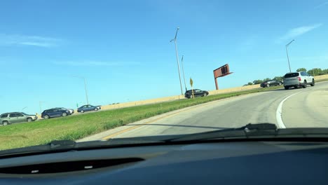 Driving-onto-the-expressway-in-suburban-Chicago-on-a-sunny-day