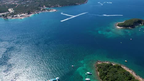 Ksamil's-Turquoise-Sea,-Islands,-Beaches,-and-Boats-Along-the-Enchanting-Seaside-Panoramic-Paradise-of-Summer-vacation