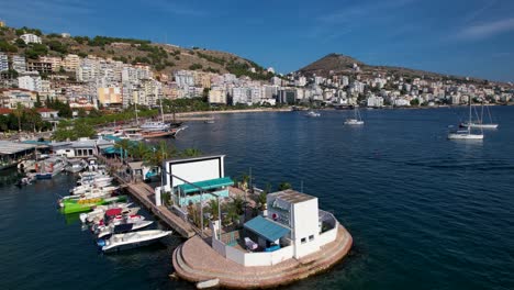 Saranda's-Tranquil-Pier:-Anchored-Tour-Boats-in-the-Coastal-City,-Perfect-for-Sunny-Summer-Vacation-and-Memorable-Resort-Beach-Holidays