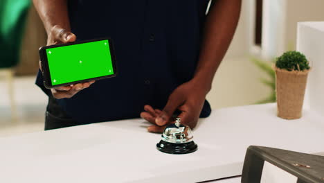 Client-holding-phone-with-greenscreen