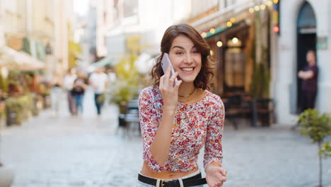 Happy-surprised-woman-involved-in-pleasant-conversation-phone-call-good-news-enjoying-talking-gossip