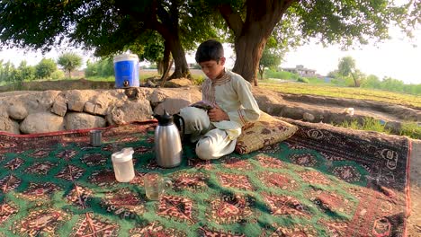 An-Afghan-child-is-reading-a-book