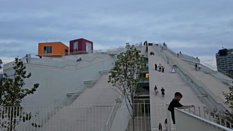 Ascending-Tirana's-Iconic-Pyramid:-Tourists-Conquer-Abstract-Architectural-Marvel-with-Multiple-Stairs-in-Albania's-Capital