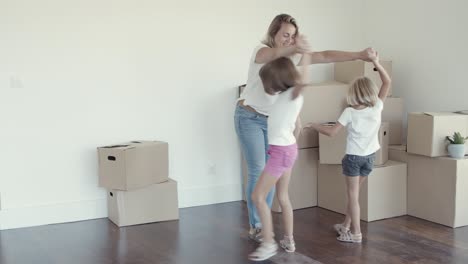 Happy-mom-dancing-with-daughters