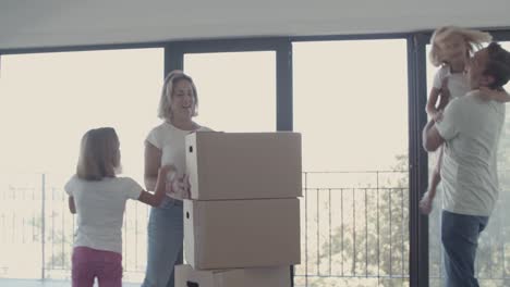 Parents-and-two-girls-celebrating-moving-into-new-apartment