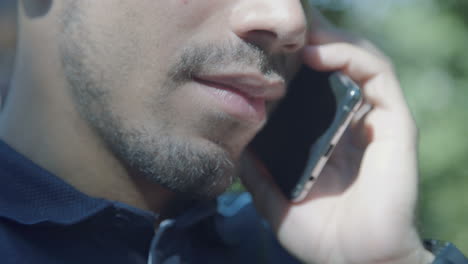 Close-up-shot-of-male-Caucasian-mouth-talking-on-phone