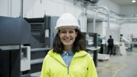Smiling-female-technician-looking-at-camera