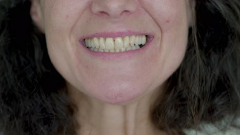 Closeup-shot-of-mature-woman-with-toothy-smile.