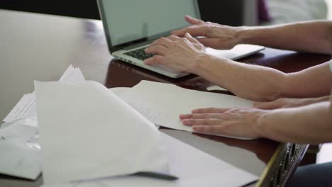 Cropped-shot-of-senior-women-working-with-laptop