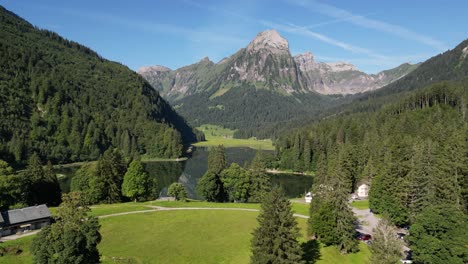 Local-people-in-Switzerland-living-in-green-fresh-air-natural-place-in-highlands-of-Alpine-Swiss-alps-lots-of-green-field-and-hiking-plan-to-trip-to-mountain-range-pine-tree-forest-calm-lake-nafels