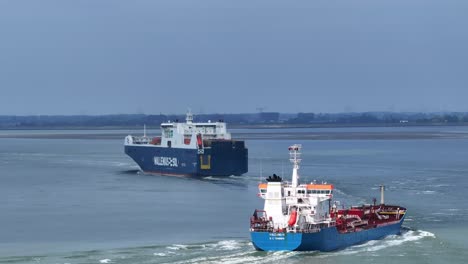 Busy-waterway-as-large-ferry-and-vehicle-carrier-ship-sail-onwards