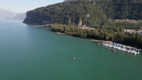Beautiful-drone-footage-of-marina-that-leads-to-long-river-that-winding-through-the-mountains