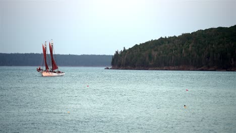 Sailboat-turns-tacking-up-into-wind-against-current,-space-for-text-on-right-side