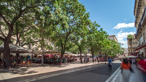 Crowds-of-people-enjoying-Place-Jean-Jaurès,-Montpellier,-France