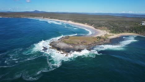 Angourie-Point-With-Scenic-Natural-Landscape-In-NSW,-Australia---aerial-pullback