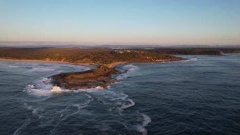 Angourie-Point-Beach-With-Scenic-Seascape-In-NSW,-Australia---aerial-pullback