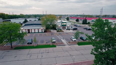 Ascending-daytime-aerial-over-RISE-Recreational-Dispensary-Mundelein---offering-medical-and-recreational-cannabis-for-medical-curbside-pickup,-in-store,-and-online-shopping