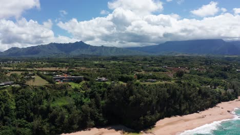 Aerial-rising-and-panning-shot-of-the-rugged-North-Shore-of-Kaua'i-near-Princeville-in-Hawai'i