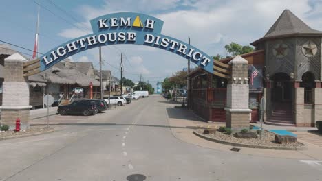 An-aerial-establishing-shot-of-the-Kemah-Lighthouse-District-sign-on-6th-St