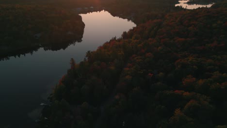 revealing-drone-shot-of-quebec-province-countryside-with-forest-and-lakes-at-sunset-during-autumn-season,-canada