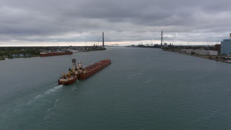 Drone-view-of-large-tanker-in-the-Detroit-River-in-Detroit,-Michigan