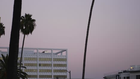 Pink-sunset-with-rooftop-building-in-Los-Angeles,-California